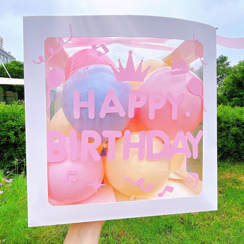 Cutie pentru Baloane, Tematica Aniversare, Model Scris Happy Birthday, Baloane Albastre, Roz, Galbene si Panglica Incluse, Contur Alb, Transparenta, 30x30 cm