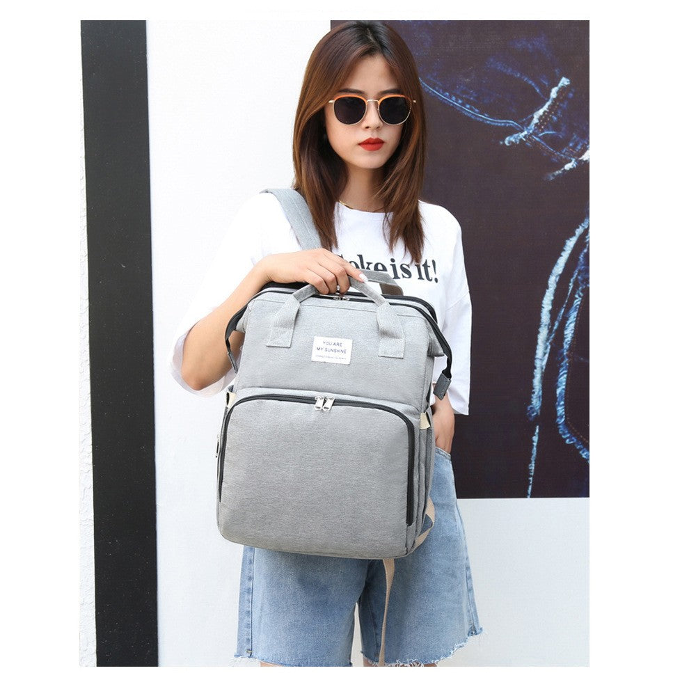 Rucsac Multifunctional pentru Mamici, cu Patut Pliabil si Baza de Schimbat, Rezistent la Apa, Capacitate Mare, Usor, Compartimente Multiple, Buzunar Termic pentru Lapte, 42 x 32 x 22 cm, Gri