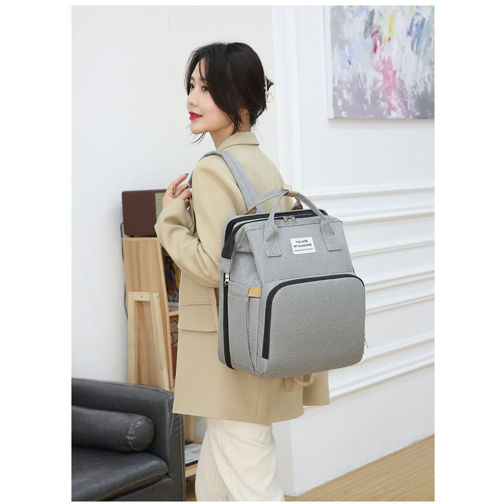 Rucsac Multifunctional pentru Mamici, cu Patut Pliabil si Baza de Schimbat, Rezistent la Apa, Capacitate Mare, Usor, Compartimente Multiple, Buzunar Termic pentru Lapte, 42 x 32 x 22 cm, Gri